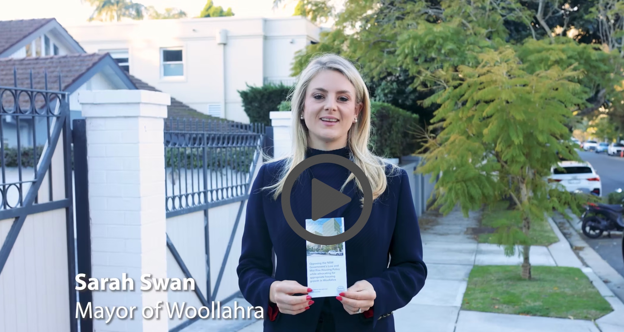 Woollahra Mayor holding brochure 
